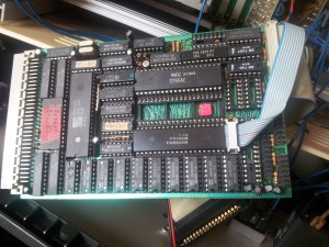 Mainboard with Z80 MCU, floppy disk controller 765, DMA controller, RAM, ROM, logic chips and cables for keyboard (grey).
